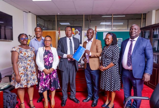 Community-Based Health Financing (CBHF) promoters led by SHU submit the draft CBHF Guidelines to Ministry of Health